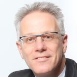 Foto von Torsten Jannack | Rechtsanwalt | Fachanwalt für Arbeitsrecht sitzend auf einem Sessel